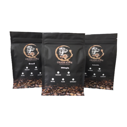 Three 250g black Cruizer Koffie bags for Brazil, Ethiopia, and Colombia single origin coffee showing roast and grind selection options.
