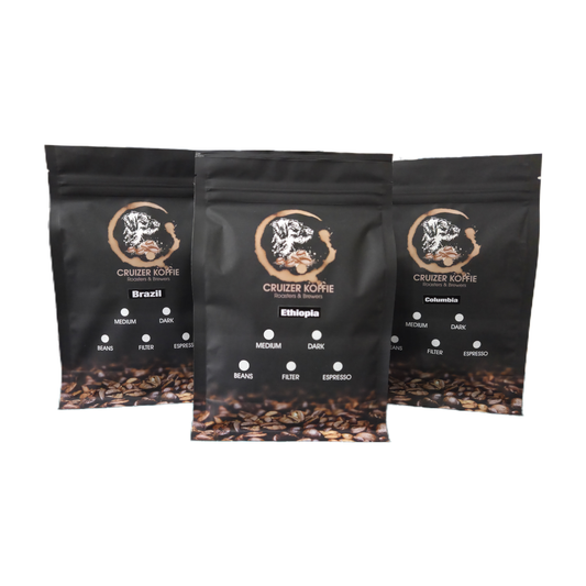 Three 250g black Cruizer Koffie bags for Brazil, Ethiopia, and Colombia single origin coffee showing roast and grind selection options.