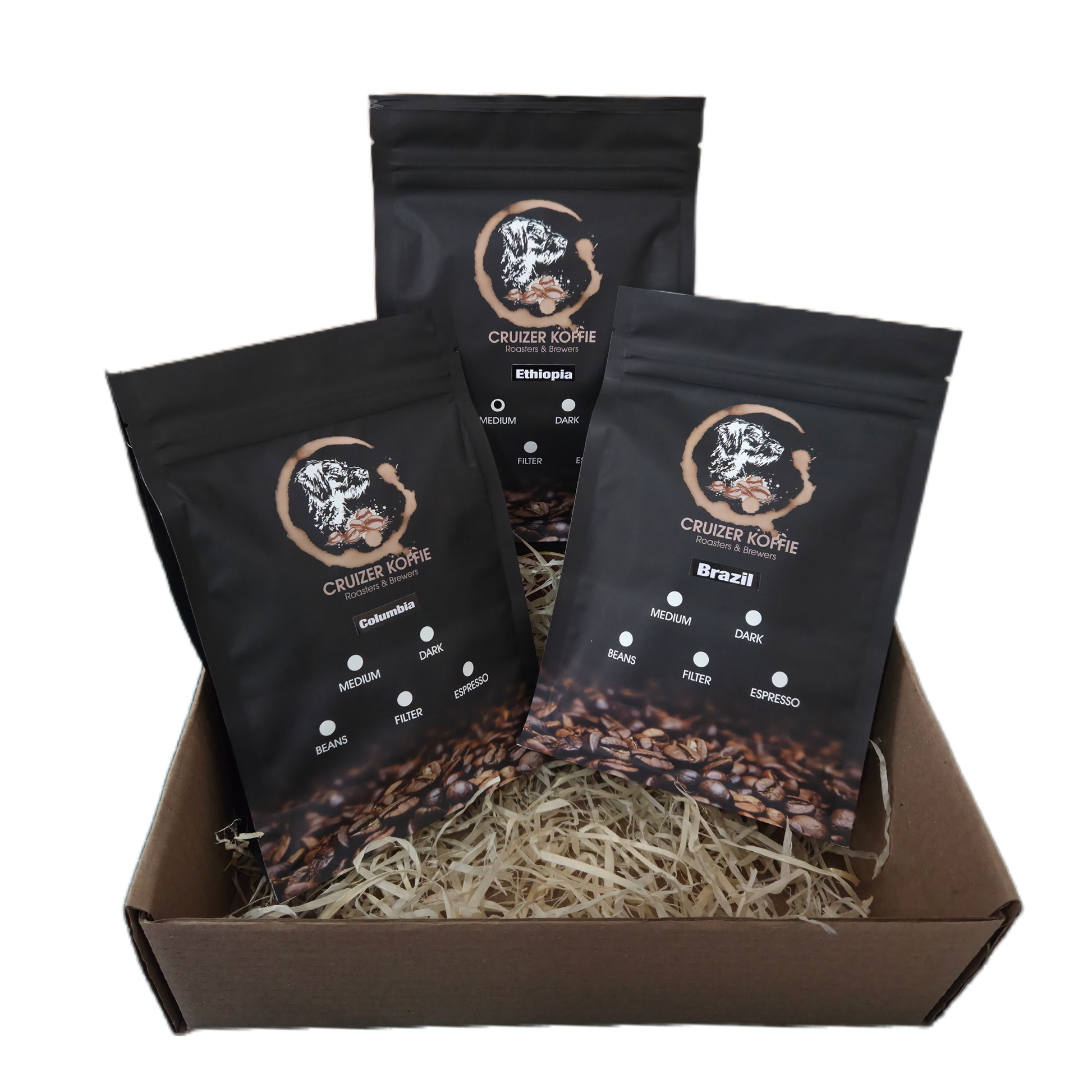 Cruizer Koffie gift box featuring three 250g single origin coffee bags from Colombia, Brazil, and Ethiopia packed in wood wool. Coffee gift box for coffee lovers.